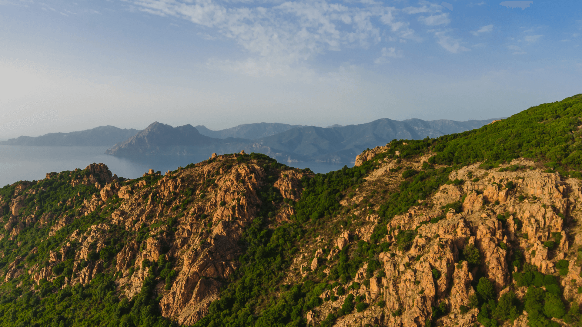 Discover the red rocks and cliffs of Les Calanques de Piana in Corsica