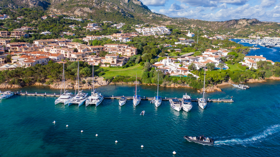 Superyacht exploring the Balearic Islands under warm autumn skies
